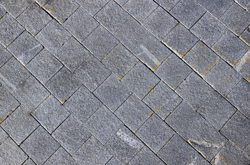Pavement made of grey granite paving stones