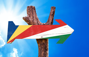 Seychelles Flag wooden sign with sky background