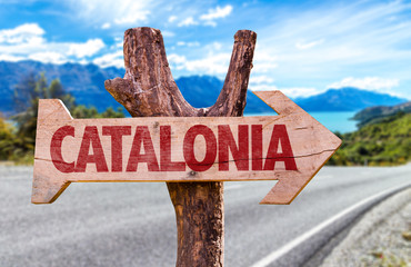 Catalonia wooden sign with road background