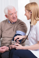 Nurse measuring blood pressure