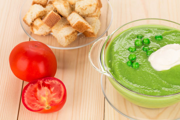 Broccoli cream soup on table.