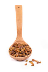 Wooden spoon with raisins.