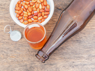 glass of whiskey and bottles