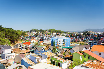 Fototapeta premium Many colorful houses of Da Lat city (Dalat) on the blue sky back