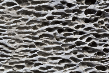 fond alvéoles surface pierre noire basaltique