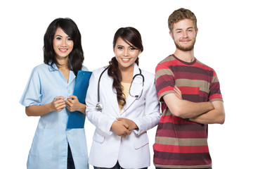 doctor, nurse, and patient smiling