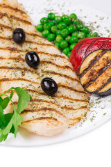 Grilled fish fillet with tasty vegetables.