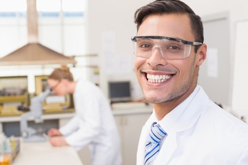 Fototapeta premium Happy scientist smiling at camera