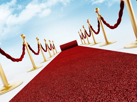 Rolled Red Carpet And Velvet Ropes