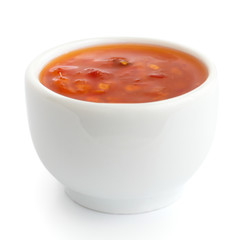Sweet chilli sauce in small white dish.