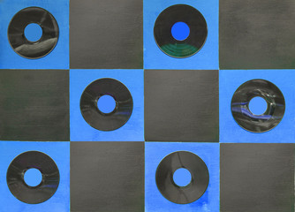 blue and black color paint with center gramophone record on squa
