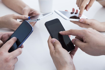 Four people have a cell phone