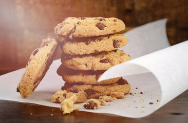 Chocolate Chip Cookies on Dark Wood Background.