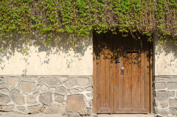 Old stone wall and wooden door, Plovdiv, Bulgaria