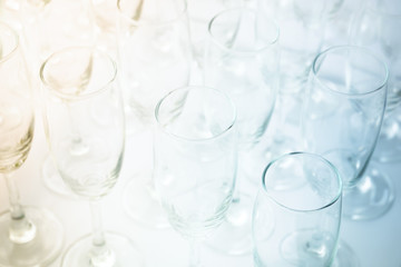 Two tone color wine glasses background.