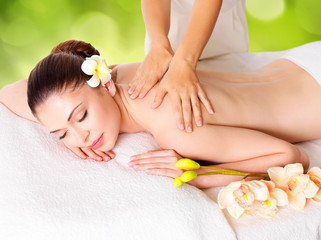 Obraz na płótnie Canvas Woman having massage of body in nature spa