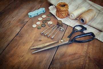 Vintage Background with sewing tools and sewing kit over wooden 