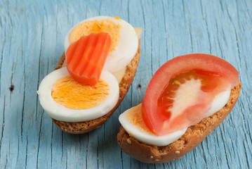 Rusks sandwich on old wooden table