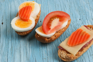 Rusks sandwich on old wooden table