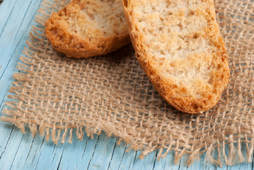 Rusks on old wooden table