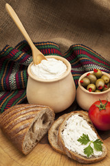 Delicious organic cream milk cheese, olives and home-made bread