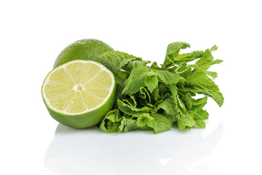 fresh limes with mint isolated on white