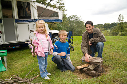 Camping: Family Building a Campfire