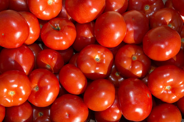 Picture of red tomatoes background.