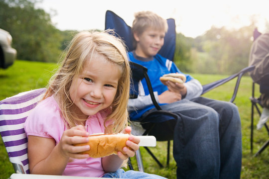 Camping: Little Girl Hungry For Hot Dog