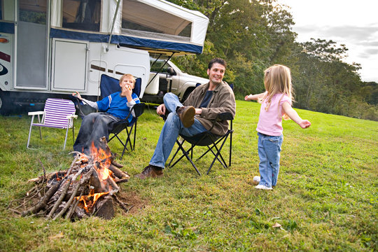 Camping: Dad Listens To Little Girl Tell a Story By The Fire