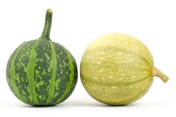 Raw pumpkins on white background