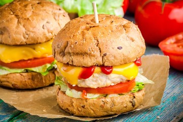 homemade burgers with fresh vegetables and chicken cutlet