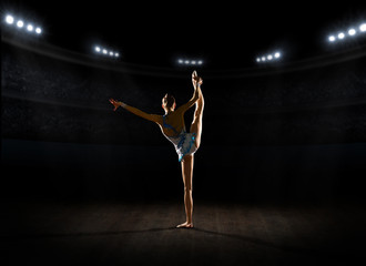 Fototapeta na wymiar Young girl engaged art gymnastic
