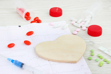 heart cardiogram spilled pills medicine.