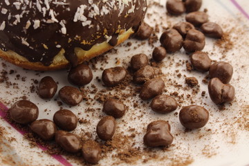 Chocolate donut and chocolate balls with cocoa powder