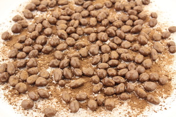 Sprinkled round chocolate balls covered by cocoa powder