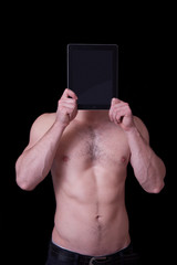 Man holding up a blank tablet pc in front of his face
