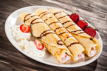 Crepes with strawberries and cream