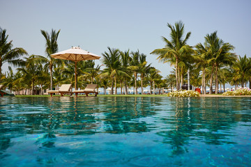 Naklejka premium Luxury swimming pool a tropical resort