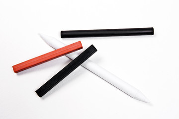 Different kinds of art tools: stamp, chalk of sanguine and charc