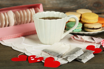 Heart shaped teabag tags, macaroons and cup of tea