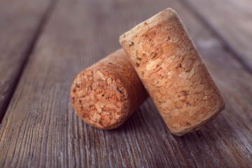 Wine corks on rustic wooden planks background