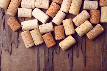 Wine corks on rustic wooden table background