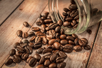 Coffee beans out from glass