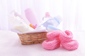 Baby accessories on table on light background
