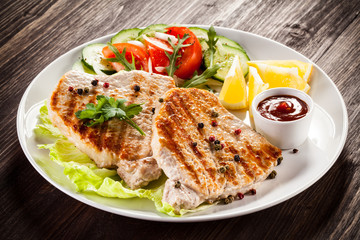 Grilled steaks and vegetable salad