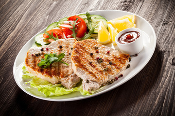 Grilled steaks and vegetable salad