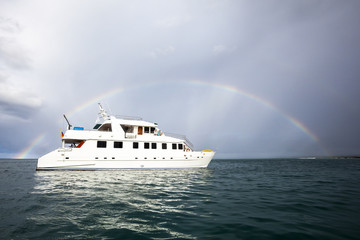 Rainbow and yacht