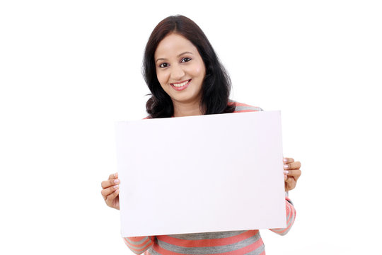 Cheerful Young Woman Holding Empty White Board