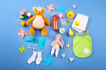 Baby collection on blue background, top view
